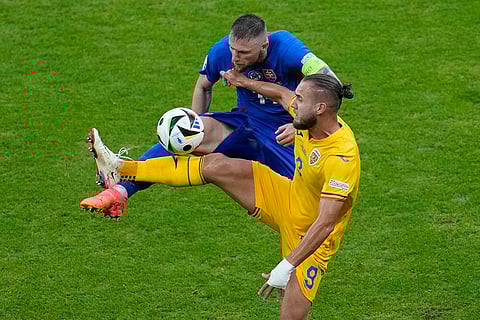 George Puscas and Milan Skriniar struggle for the ball